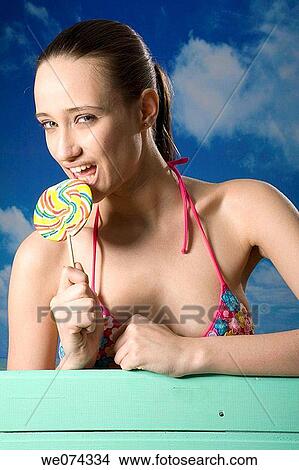 bite, biting, brunette View Large Photo Image Picture - bite, biting, brunette. Fotosearch