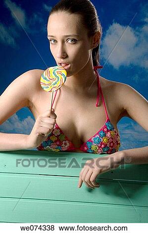 bite, biting, brunette View Large Photo Image Stock Photo - bite, biting, brunette. Fotosearch