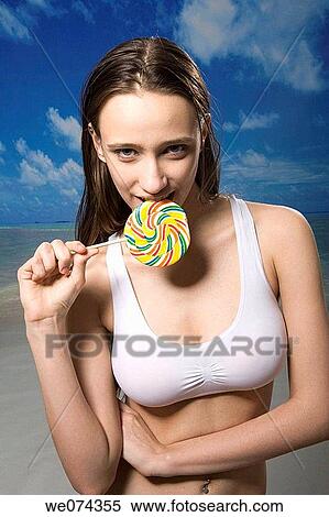 bite, biting, brunette View Large Photo Image Stock Photography - bite, biting, brunette. Fotosearch