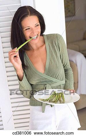 bite, brunette, biting, Asparagus View Large Photo Image Stock Photograph - bite, brunette, biting, Asparagus. Fotosearch