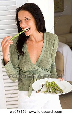 bite, brunette, biting, Asparagus View Large Photo Image Stock Photograph - bite, brunette, biting, Asparagus. Fotosearch