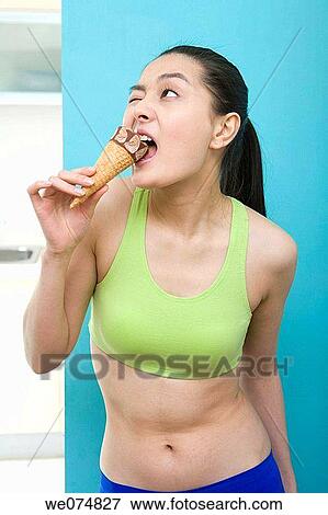 Stock Photo - bite, calorie, biting, Asian. Fotosearch