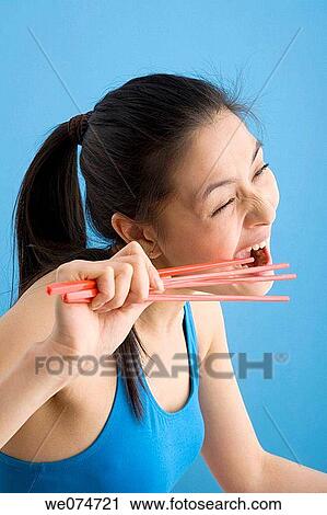 bite, chopstick, biting, Asian View Large Photo Image Stock Image - bite, chopstick, biting, Asian. Fotosearch