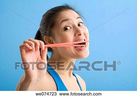 bite, Close-up, chopstick, biting, Asian View Large Photo Image Stock Image - bite, Close-up, chopstick, biting, Asian. Fotosearch