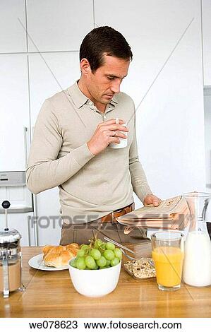Stock Image - black hair, coffee, breakfast, at-home. Fotosearch