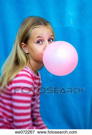 Stock Photo - blond, child, chicle, chewing gum, amusing. Fotosearch