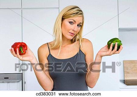 Stock Image - blond, choosing, choice, at-home. Fotosearch