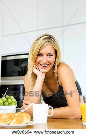 Picture - blond, coffee, breakfast, at-home. Fotosearch