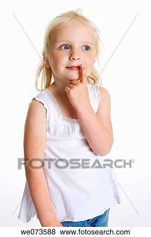 Blond girl with her finger on her mouth View Large Photo Image Stock Photo - Blond girl with her finger on her mouth. Fotosearch