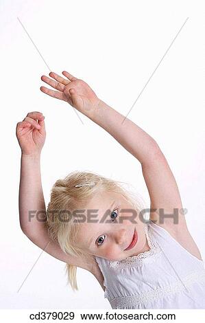 Stock Photo - Blond girl with her hands high. Fotosearch
