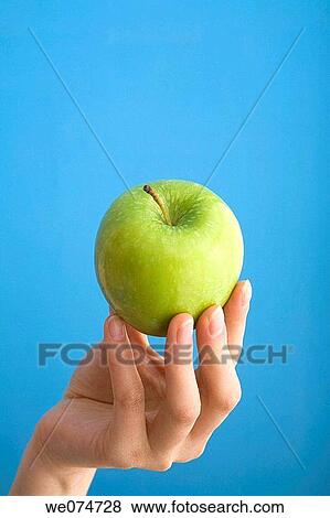 Stock Photo - blue, Female, Close-up, apple. Fotosearch