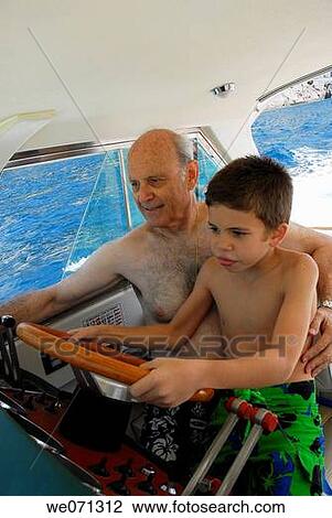 Stock Image - boat, child, boy, amusement. Fotosearch