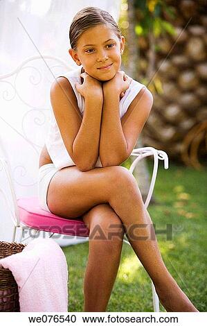 Stock Image - Body care, chair, calm, absorbed. Fotosearch