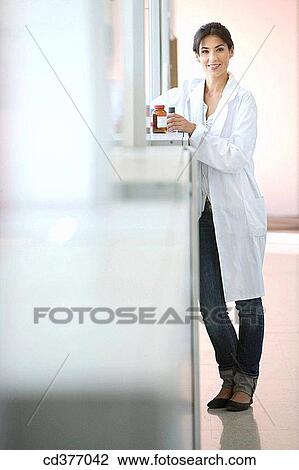 Stock Image - bottle, brunette, corridor. Fotosearch
