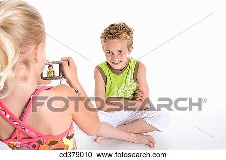 Brother and sister making photos of each other View Large Photo Image Stock Image - Brother and sister making photos of each other. Fotosearch