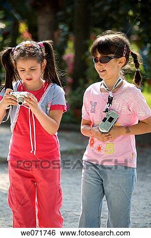 brunette, camera, child, companion View Large Photo Image Stock Photograph - brunette, camera, child, companion. Fotosearch