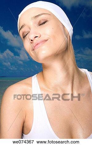 Stock Photo - brunette, cap, contemporary. Fotosearch