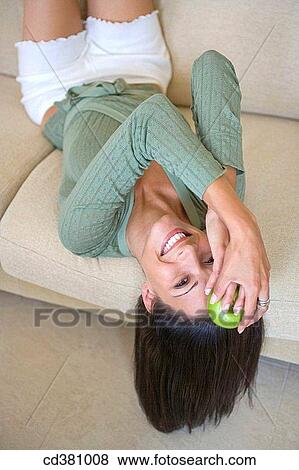 brunette, carefree, apple View Large Photo Image Stock Photo - brunette, carefree, apple. Fotosearch