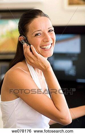 brunette, cell phone, at-home View Large Photo Image Stock Photograph - brunette, cell phone, at-home. Fotosearch