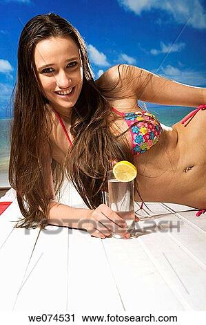 Stock Image - brunette, cold drink. Fotosearch
