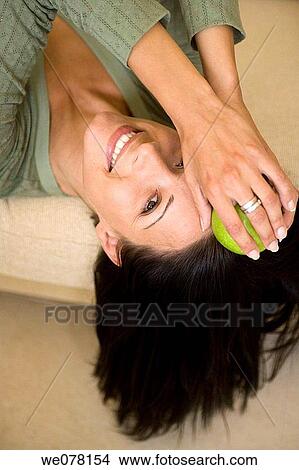 brunette, contemporary, apple View Large Photo Image Picture - brunette, contemporary, apple. Fotosearch