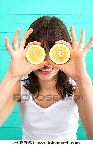 brunette, contemporary, Citrus fruit, amusing View Large Photo Image Stock Photo - brunette, contemporary, Citrus fruit, amusing. Fotosearch