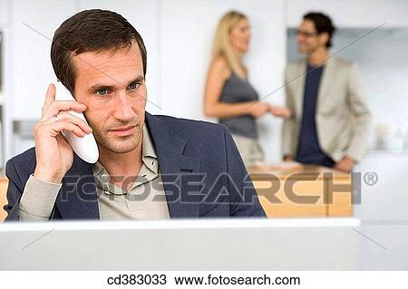 Stock Image - business, calling, colleague. Fotosearch