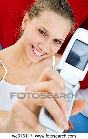 Stock Photo - camera, cell phone, communication. Fotosearch