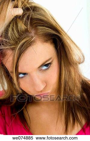 Stock Photography - Close-up of a young woman posing.. Fotosearch
