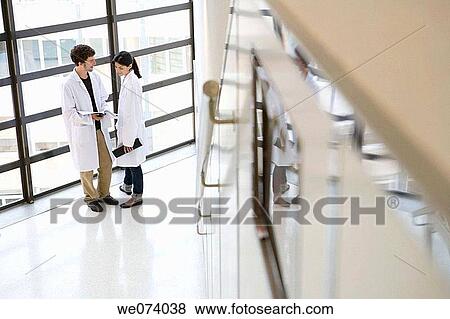 Stock Photo - colleague, companion, consult. Fotosearch