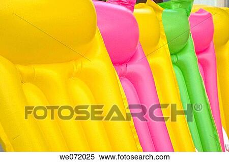 Stock Photography - Colorful pool rafts. Fotosearch