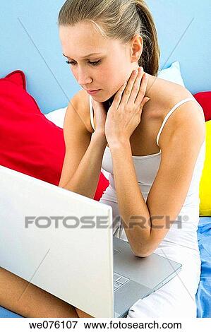 Stock Photo - computer, contemporary, cross-legged. Fotosearch