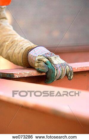Construction steel worker hand in glove holding steel I beam View Large Photo Image Stock Photograph - Construction steel worker hand in glove holding steel I beam. Fotosearch