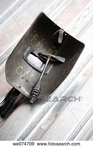 Stock Photo - Construction welders mask and hammer. Fotosearch