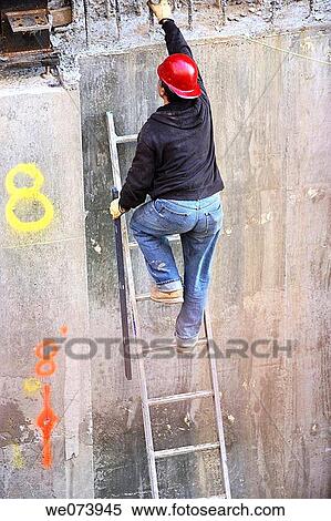 Construction worker climbing up ladder View Large Photo Image Stock Photography - Construction worker climbing up ladder. Fotosearch