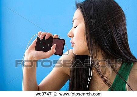 contemporary, emotion, earphone, Asian View Large Photo Image Stock Image - contemporary, emotion, earphone, Asian. Fotosearch