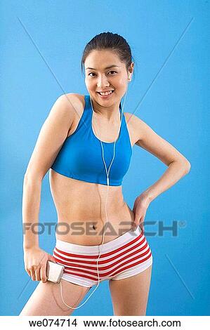 contemporary, ethnic, earphone, Asian View Large Photo Image Picture - contemporary, ethnic, earphone, Asian. Fotosearch