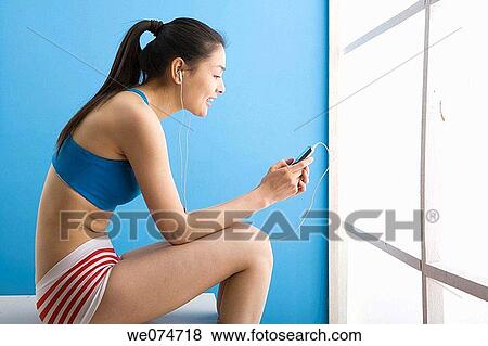 contemporary, ethnic, earphone, Asian View Large Photo Image Stock Photo - contemporary, ethnic, earphone, Asian. Fotosearch