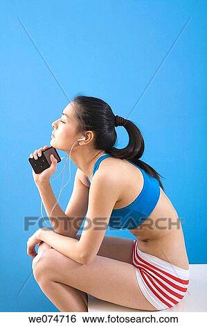 contemporary, ethnic, earphone, Asian View Large Photo Image Stock Photograph - contemporary, ethnic, earphone, Asian. Fotosearch