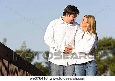 Couple walking in the park by wooden bridge, Deerfield Beach, Florida, USA View Large Photo Image Stock Photograph - Couple walking in the park by wooden bridge, Deerfield Beach, Florida, USA. Fotosearch
