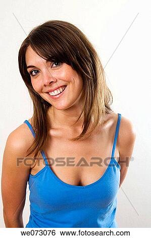 Cute early 20's caucasian female poses for the camera in a head, shoulders and bust studio portrait. View Large Photo Image Stock Photograph - Cute early 20's caucasian female poses for the camera in a head, shoulders and bust studio portrait.. Fotosearch