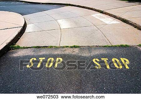 Driveway with the word? STOP? written on it twice View Large Photo Image Stock Image - Driveway with the word? STOP? written on it twice. Fotosearch