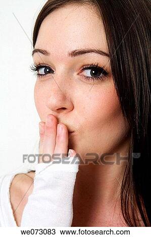 Early 20's caucasian female prepares to blow a kiss in studio portrait. View Large Photo Image Stock Image - Early 20's caucasian female prepares to blow a kiss in studio portrait.. Fotosearch