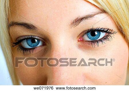 Facial close-up of blue eyes of young blond woman in a studio portrait, Los Angeles, California, USA View Large Photo Image Stock Photograph - Facial close-up of blue eyes of young blond woman in a studio portrait, Los Angeles, California, USA. Fotosearch