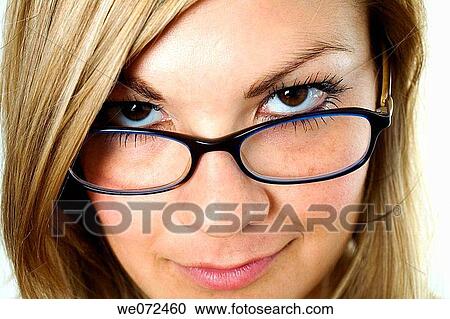 Facial closeup of young blond woman wearing glasses in studio portrait. View Large Photo Image Stock Image - Facial closeup of young blond woman wearing glasses in studio portrait.. Fotosearch
