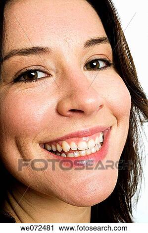 Facial closeup of young brunette woman smiling in studio. View Large Photo Image Stock Image - Facial closeup of young brunette woman smiling in studio.. Fotosearch