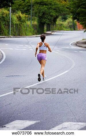 Female runner going uphill View Large Photo Image Stock Photograph - Female runner going uphill. Fotosearch