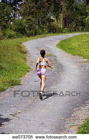 Female runner going uphill View Large Photo Image Stock Photography - Female runner going uphill. Fotosearch