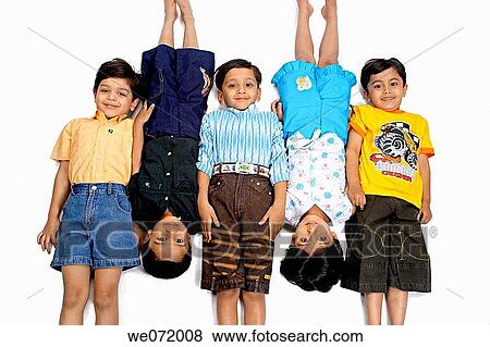 Five kids laying on ground in a alternate positions. View Large Photo Image Stock Photo - Five kids laying on ground in a alternate positions.. Fotosearch