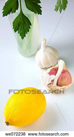 Garlic, parsley and lemon View Large Photo Image Stock Photo - Garlic, parsley and lemon. Fotosearch
